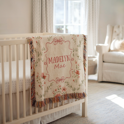 Personalized floral baby blanket with bow frame and custom name for girl nursery decor
